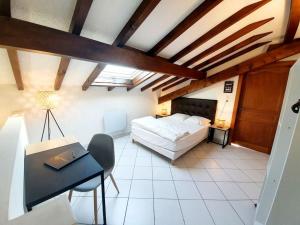 Appartements duplex cocooning a 10 min a pied du centre ville : photos des chambres