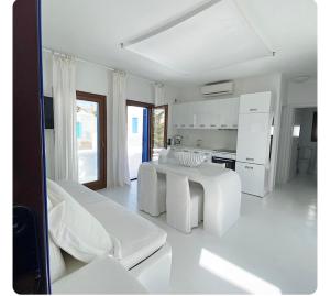 White luxury suite with shared pool downtown by Mykonos Eight