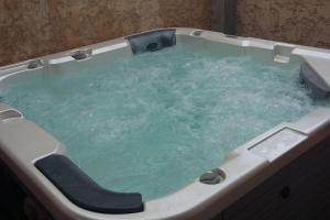 Maisons de vacances Maison avec jacuzzi : photos des chambres