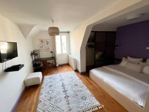 Maisons de vacances Le Gite de la Poterne, maison en bordure du Serein : photos des chambres