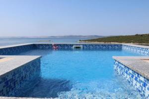 Seaside family friendly house with a swimming pool Cove Ladjin - Landjin, Pasman - 20394