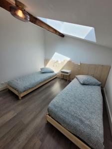 Appartements Duplex cosy & lumineux en plein centre bourg : photos des chambres