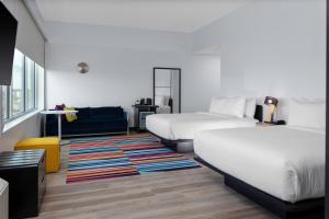 Larger Guest room, 2 Queen room in Aloft Orlando Lake Buena Vista