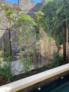 Maisons de vacances Maison atypique avec jardin et piscine : photos des chambres