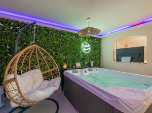 Appartements L'instant Borneo Superbe appartement avec jacuzzi : photos des chambres