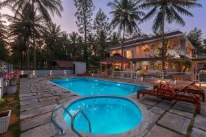 StayVista at Bask In The Greens Coorg with Private Pool - Kushālnagar