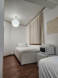 Phòng Cơ bản cho 3 người với phòng tắm dùng chung (Basic Triple Room with Shared Bathroom)