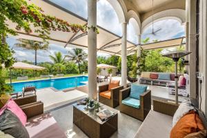 SaffronStays Zuma Villa - 7BR pet-friendly villa with heated pool, 6000 sqft lawn, play zone & cards room near Pawna Dam