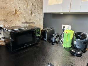 Appartements L'echoppe Bergeracoise, Salle de jeux, Climatisation et terrasse : photos des chambres