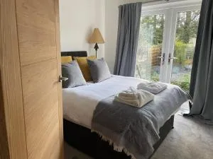 Rawtenstall bungalow. Steam train passes garden. - Stubbins