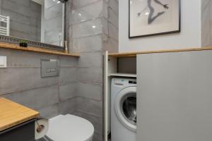 Wola Apartment with Balcony Sokołowska by Noclegi Renters