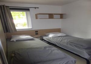 Appartements Elegant- dans camping 5 etoiles - acces lac -2 sdb : photos des chambres