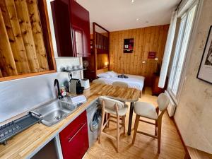 Appartements Le Woody, Centre-ville, Parking gratuit : photos des chambres