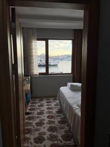Two-Bedroom Apartment room in A Beachfront Peninsula View Apartment in Karaköy