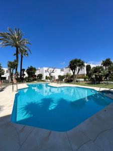 Impeccable large apartment with immense terrace and private garden overlooking the mountain, featuring 2 bedrooms and sleeping up to 4 guests located 100 meters from Plaza Maestranza