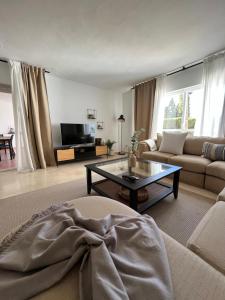 Impeccable large apartment with immense terrace and private garden overlooking the mountain, featuring 2 bedrooms and sleeping up to 4 guests located 100 meters from Plaza Maestranza