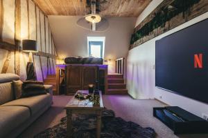 Appartements Le Duplex de l'Etoile home cinema jacuzzi et sauna privatif : photos des chambres