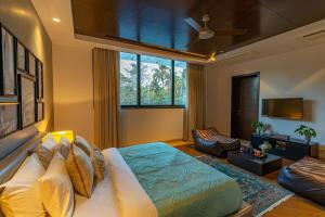 Oceanic Sunsets with River View, Comp Breakfast & Infinity Pool at StayVista