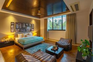 Oceanic Sunsets with River View, Comp Breakfast & Infinity Pool at StayVista