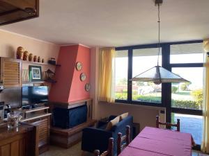 Flowers & garden apartment con vista lago
