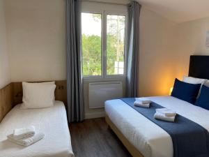 Hotels Logis Hotel Emeraude des Bois : photos des chambres