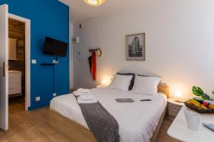 Appartements VilleneuveCityStay - Tropical & Studio Chic : photos des chambres