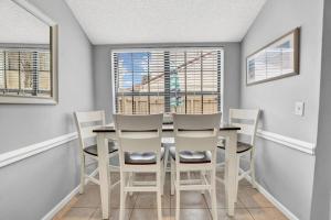 2 BR townhome wprivate patio, beach access, 4 communal pools, hot tub, mini golf, tennis, & more!
