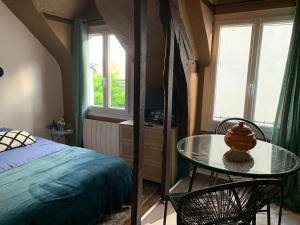 Appartements Ici et ailleurs : photos des chambres