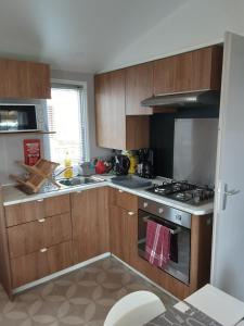 Appartements location mobil home 251 sur un camping haut de gamme : photos des chambres