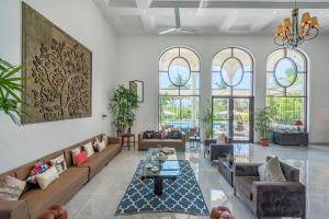 SaffronStays Zuma Villa - 7BR pet-friendly villa with heated pool, 6000 sqft lawn, play zone & cards room near Pawna Dam