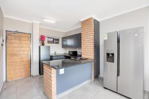 Opposite Mall of Africa Inn