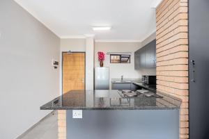 Opposite Mall of Africa Inn