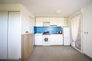 Appartements Grand Studio Moana proche Parc Exposition et Plages : photos des chambres