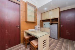 RedLiving Apartemen Tamansari Panoramic - Rasya Room