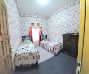 Penginapan Syariah Dhifa Indonesian only