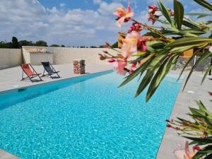 Appartements appart cosy avec son exterieur chaleureux,piscine et parking prive : photos des chambres