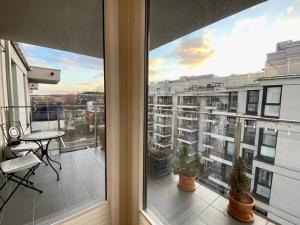 White and Bright Riverside View Flat with Parking, Bike Access, and Onsite Gym