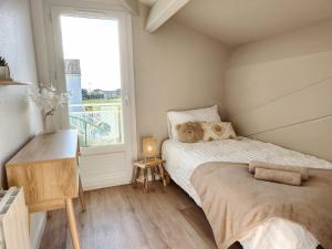 Maisons de vacances Maison Les Dunes avec piscine collective : photos des chambres