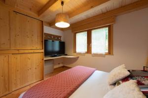 Chalets L’Ecrin Blanc – Cocon familial avec jacuzzi et salle de jeux : photos des chambres