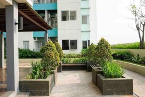 Minimalist room at The Nest Apartment by Popobella Near Puri Indah West Jakarta