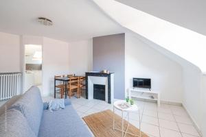 Appartements Le pigeonnier, vue sur les toits : photos des chambres