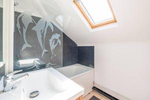 Appartements Le pigeonnier, vue sur les toits : photos des chambres