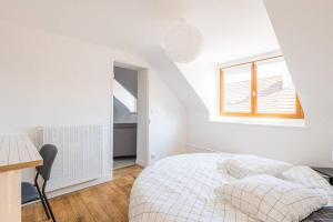 Appartements Le pigeonnier, vue sur les toits : photos des chambres