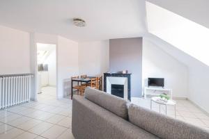 Appartements Le pigeonnier, vue sur les toits : photos des chambres