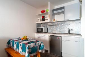 Appartements Ti Kreol - 5 minutes des plages : photos des chambres