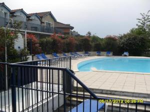 Appartements Appt HAMEAU DU LAC avec piscine et vue sur le lac : photos des chambres