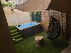 Appartements suite spa jacuzzi tout confort : photos des chambres