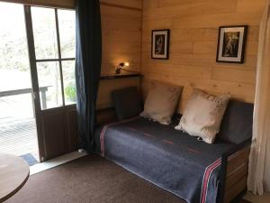 Chalets La cabane sur le lac aux Temps des Sources : photos des chambres