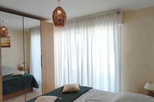 Appartements T2 CALME + cadre verdoyant : photos des chambres