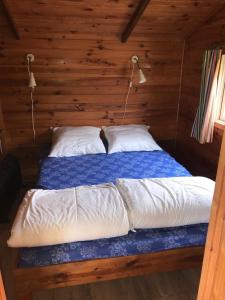 Chalets Houten chalet : photos des chambres